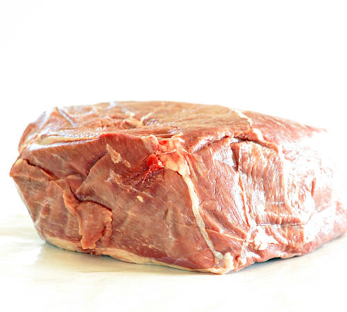 beefshoulderroast Raw beef brisket on a white background, showcasing its marbled texture and natural color, ideal for slow cooking or barbecue recipes.